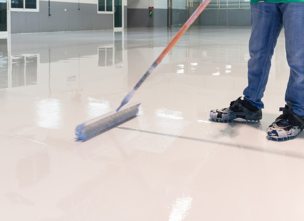 Industrial flooring being finished with a wide roller